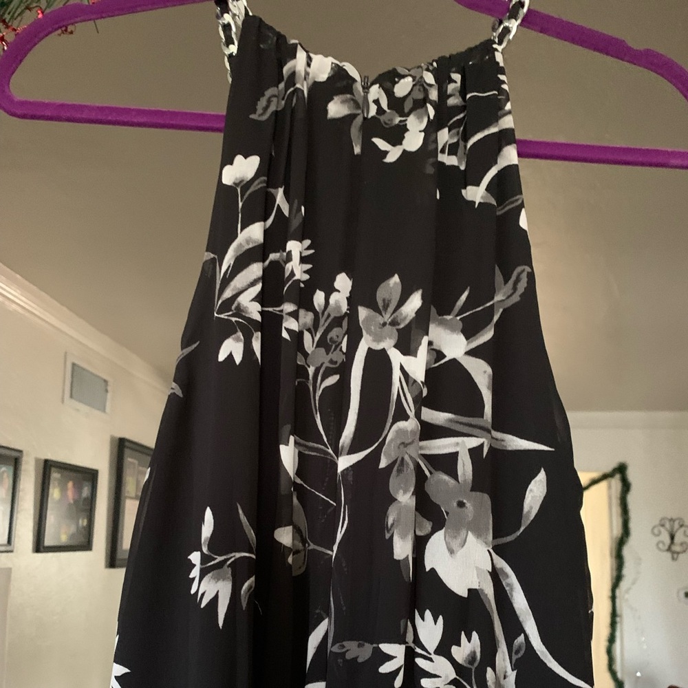 Unique pantsuit with sheer overlays in front and back of pants.